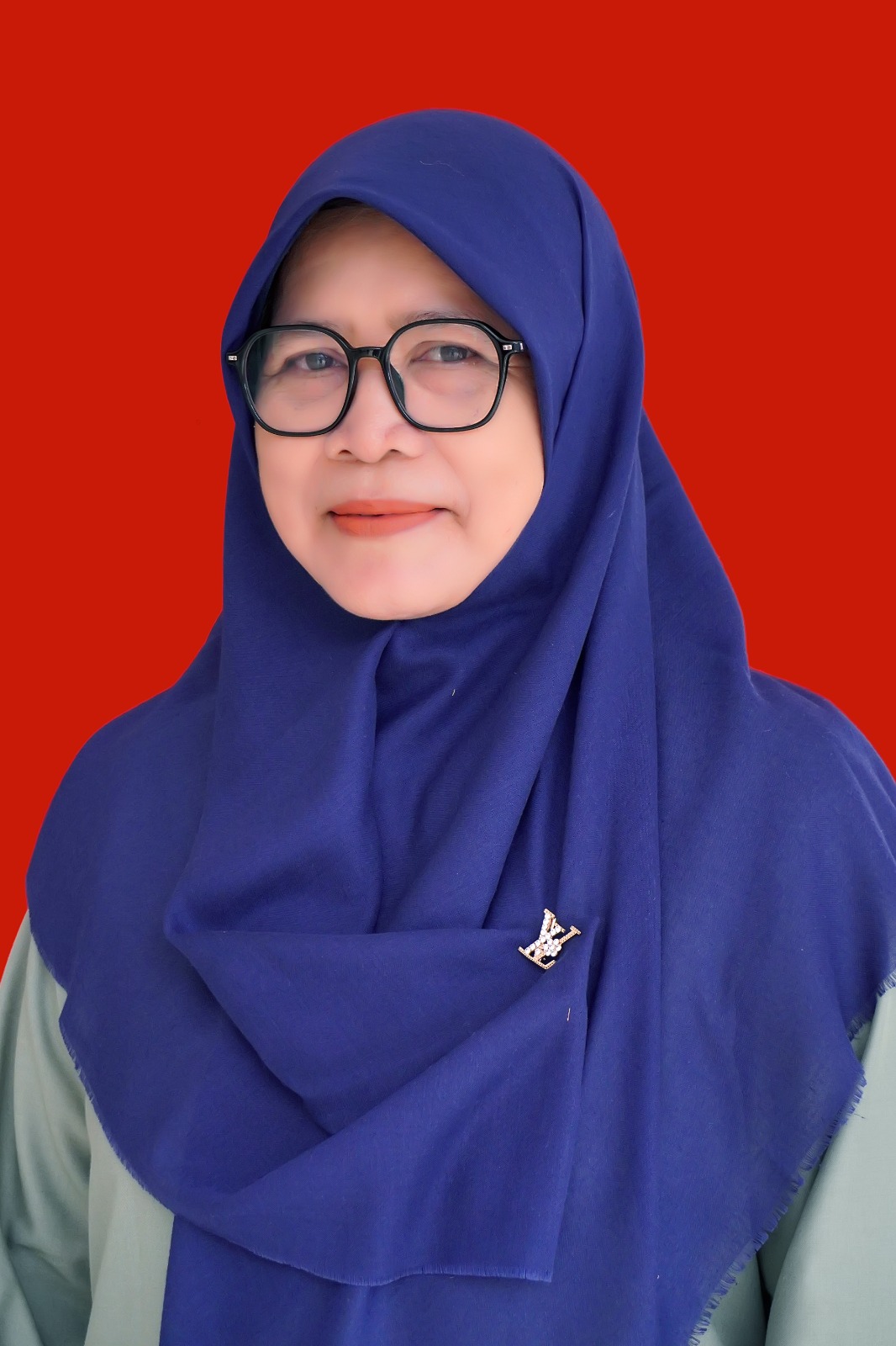 Dra. Ela Kursilawati Septiani